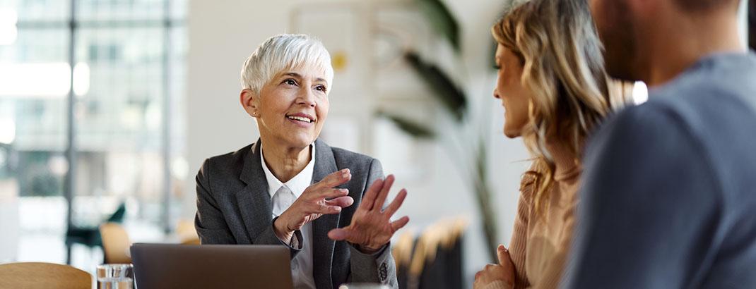 Real estate professional discussing options with potential buyers