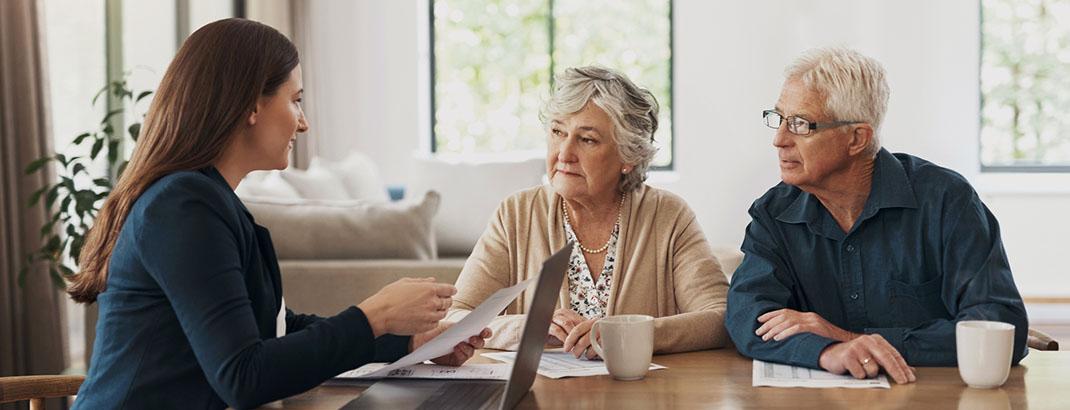 Agent at a table with homebuyers